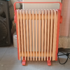 美的(Midea)取暖器 电暖器 电暖气片 家用小型/轻音加湿烘衣 13片大面积劲暖3档节能电热油汀HYX22K(樱落)晒单图