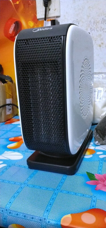 美的暖风机hf18c小型取暖器烤火炉节能暖气居家办公室台式暖风机1500w