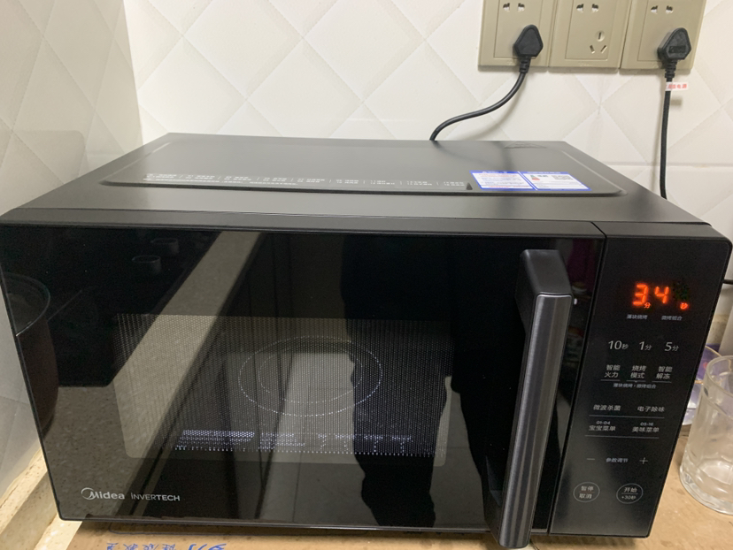美的(Midea)智能变频 微波炉 烤箱一体机 900瓦平板加热 智能杀菌 家用微波炉 25L PC2323W晒单图