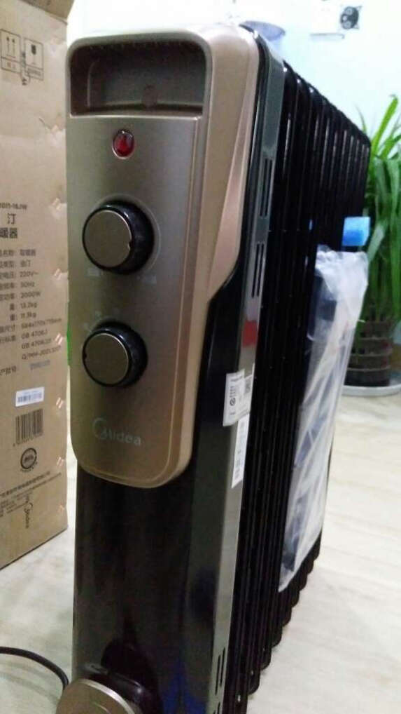 美的(Midea)取暖器/电热油汀/加热电暖器/立式电暖气片/加热器家用大面积加湿恒温 NY2513-16JW晒单图