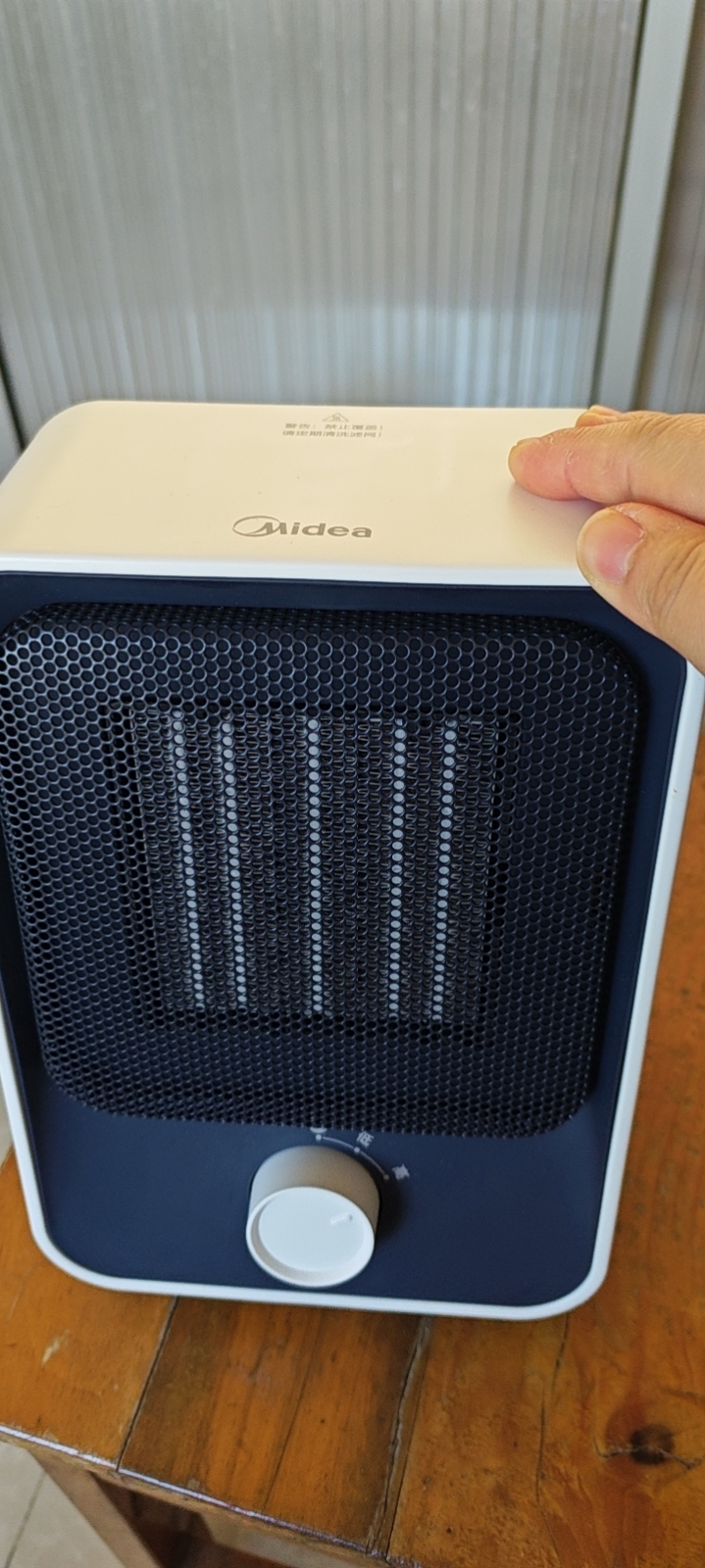 美的(Midea)暖风机HFU15D家用小太阳取暖器小型电暖器电暖气电热风扇暖手宝台地两用速热便携晒单图