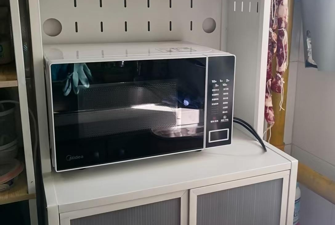 美的(Midea)微波炉20L大容量平板易清洁内胆智能菜单高效速热一键解冻杀菌除味宝宝菜单黑色M22J晒单图