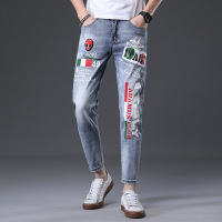 策恩公牛九分牛仔裤男装潮流破洞男式小脚裤子街潮时尚印花弹力修身韩版裤