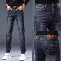 秋冬新款高端牛仔裤男士潮牌印花直筒弹力修身小脚长裤休闲