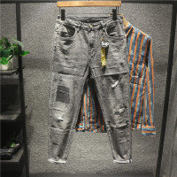 新款Hi 欧美范破洞刮烂拼接乞丐牛仔裤男士吊坠装饰修身百搭小脚裤