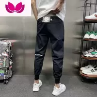 七斓秋季新款网红痞帅潮牌ins黑色拼接休闲裤九分束脚运动裤子男