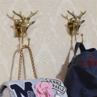 北欧鹿头装饰挂钩纳丽雅创意轻奢铜艺术浴室墙壁粘钩免打孔挂勾