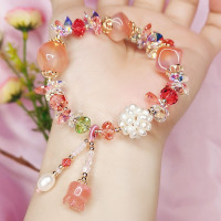 奥地利水晶甜美蜜桃粉玛瑙手链女气质流苏贝母花原创设计饰品手串