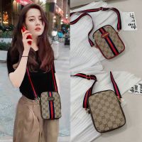 装手机包女2020网红新款韩版印花斜挎包宽肩带迷你竖版零钱包