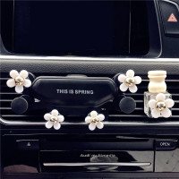 火豹小雏菊车载手机支架夹紧女汽车横竖出风口车用导航夹女士 一条雏菊支架+香薰瓶手机座