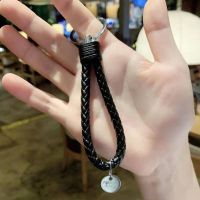 钥匙扣新品卡通ins天使宝宝鬼灭滑板车包包汽车韩版少女 真皮手绳 黑色