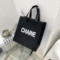 高级感时尚手提袋帆布包包大容量便携化妆包手拎妈咪包上班收纳包 黑色款一字母