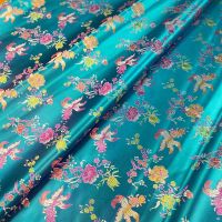 布料尼龙织锦缎金鱼花服装面料 湖蓝色