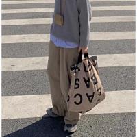 2021年春季新款小众设计拼色字母手提防水布包袋大包百搭慵懒ins 淡卡其色