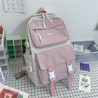 书包男大学生初高中生日系休闲大容量旅行包男潮牌双肩包电脑包女 粉色[无挂件]