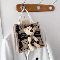 可爱小熊包包女2021新款斜挎包女学生百搭手提化妆包饭盒袋便当包 黑色m 小熊涂鸦玩偶包