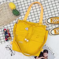 新款韩版帆布包女单肩斜跨双背多用大容量简约百搭时尚学生帆布包 黄色木珠款多功能多兜款 +腮红熊