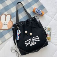 2021新款帆布包女学生韩版单肩上课百搭斜挎包日系大容量手提书袋 09款 黑色普通 无挂件