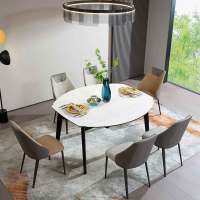 一桌两用的功能拉合餐台 伊丽莎白亮光岩板时尚、美观,耐磨耐刮,方便打理油污 餐椅符合人体工程学,采用环抱式设计
